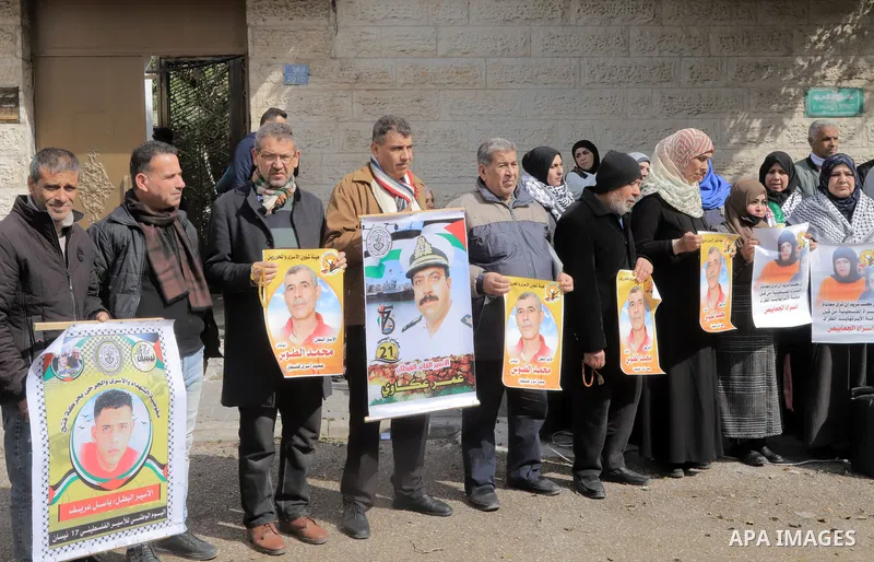 Palestinians take part in a protest in support prisoners in Israeli jails, in front of Red Cross office in Gaza city on February 12, 2023. Nearly 7,000 Palestinians were arrested by the Israeli forces in the Palestinian...