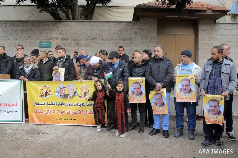 Palestinians take part in a protest in support prisoners in Israeli jails, in front of Red Cross office in Gaza city on February 12, 2023. Nearly 7,000 Palestinians were arrested by the Israeli forces in the Palestinian...