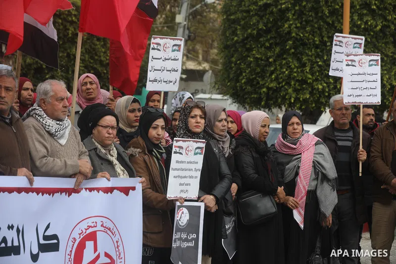 Palestinians take part in a rally in solidarity with Turkey and Syria following a deadly earthquake, in Gaza city on February 09, 2023. Turkey's death toll has risen to 12,873 overnight, from 12,391 late on Wednesday, th...