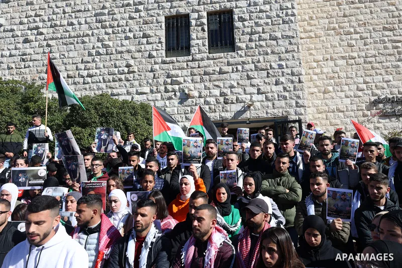 Palestinian students from Birzeit University take part in a protest following the killing of Palestinians Jawad Farid Bawaqna and Adham Mohammed Bassem Jabareen, in the West Bank city of Ramallah on January 19, 2023. Two...