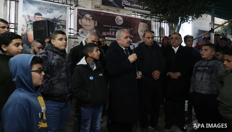 Palestinian Prime Minister Mohammad Shtayyeh condolences to the family of the 14-year-old Amr Khaled Khumour, who was killed by Isareli forces, in Dheisheh camp in the West Bank city of Bethlehem on January 18, 2023. Pho...