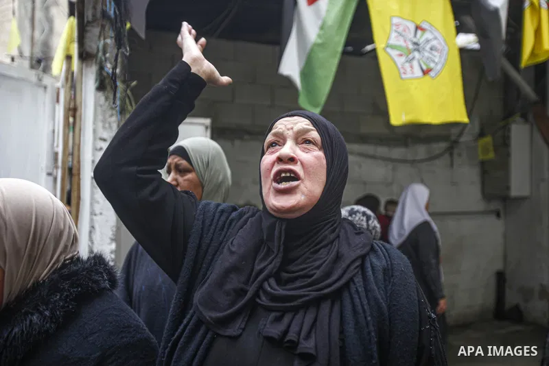 Mourners attend the funeral of Palestinian teenager Amer Abu Zeitoun, 16, killed in clashes between Palestinian militants and Israeli forces during an overnight raid on the Balata refugee camp in the town of Nablus, on J...