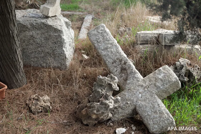 A general view shows vandalised graves at the Protestant Christian cemetery of Mount Zion outside Jerusalem's Old City on January 4, 2023. The Protestant Christian cemetery on Mount Zion in Jerusalem was vandalized on Su...