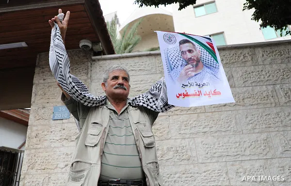 Palestinians take part in a protest in solidarity with prisones held in Israeli Jails in front of Red Cross Office in Gaza city on October 02, 2023. According to the latest figures from Addameer, the Palestinian Prisoner...