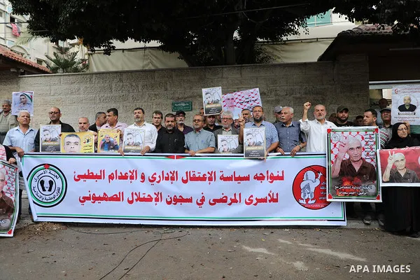 Palestinians take part in a protest in solidarity with prisones held in Israeli Jails in front of Red Cross Office in Gaza city on October 02, 2023. According to the latest figures from Addameer, the Palestinian Prisoner...