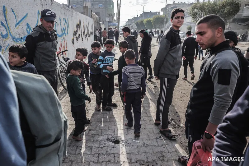 Residents inspect the area after two Palestinians lost their lives following Israeli army targeted them in Rafah, Gaza on January 03, 2024. Photo by Bashar Taleb\ apaimages