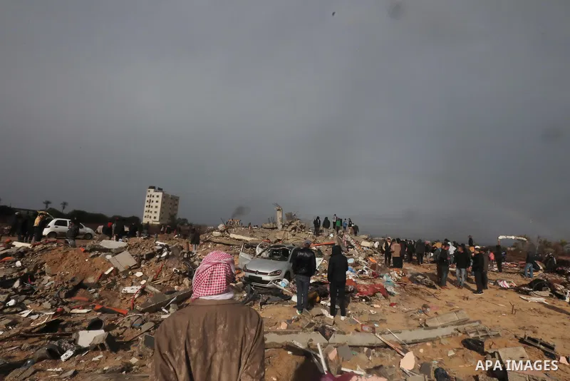 Residents and civil defense teams carry out a search and rescue operation around the rubble of the building demolished after Israeli attack in El-Zawaida, Gaza on January 29, 2024. Many buildings were destroyed or heavil...