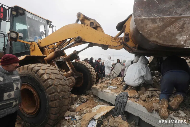 Residents and civil defense teams carry out a search and rescue operation around the rubble of the building demolished after Israeli attack in El-Zawaida, Gaza on January 29, 2024. Many buildings were destroyed or heavil...