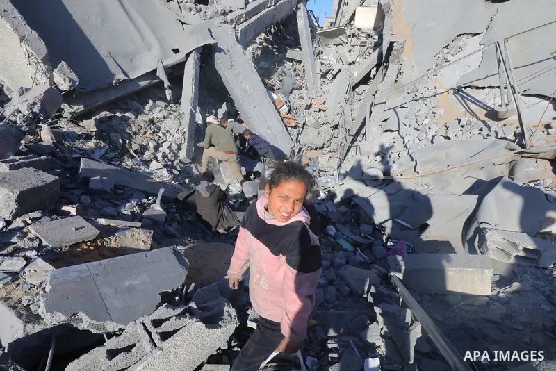 Palestinians inspect amid the rubble of Al-Urube school following the Israeli attack on the Nuseirat refugee camp in Deir al-Balah, Gaza on January 31, 2024. Photo by Naaman Omar\ apaimages