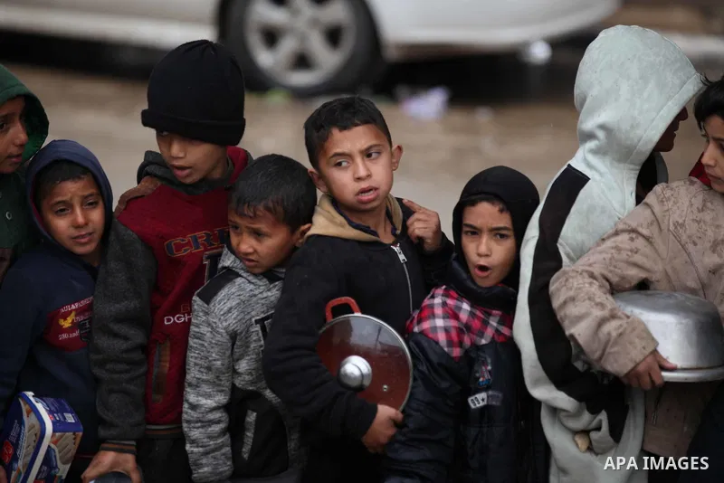 Palestinians including children face extreme hunger as the food distributed by charity organizations are not delivered to people due to the ongoing humanitarian aid blockade in Dair El-Balah, Gaza on February 2, 2024. Ph...