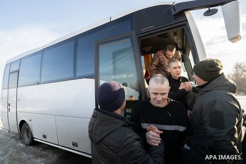 Ukrainian former prisoners of war wrapped in a Ukrainian flag, following a prisoner exchange, amid Russia's military invasion on Ukraine. Russia and Ukraine exchanged hundreds of prisoners of war on January 31, just a we...