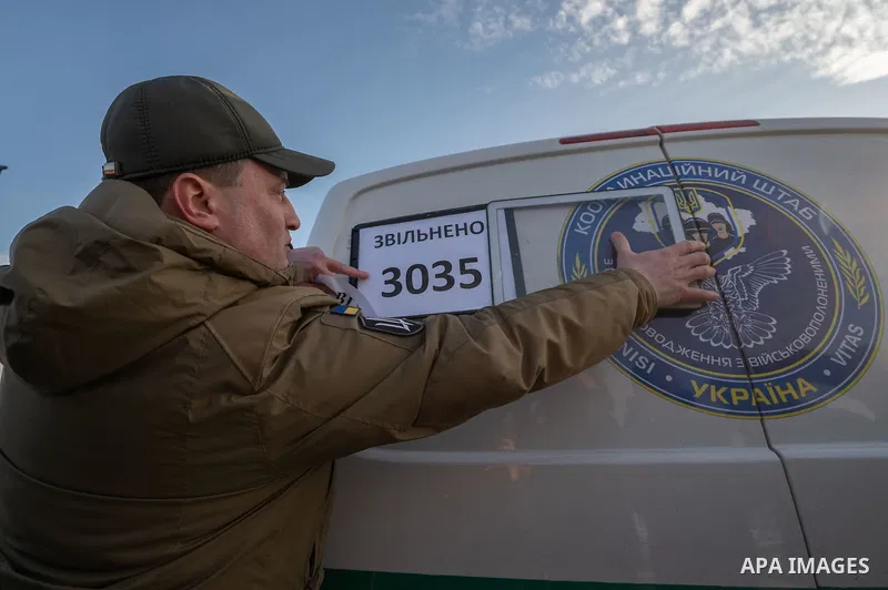Ukrainian former prisoners of war wrapped in a Ukrainian flag, following a prisoner exchange, amid Russia's military invasion on Ukraine. Russia and Ukraine exchanged hundreds of prisoners of war on January 31, just a we...
