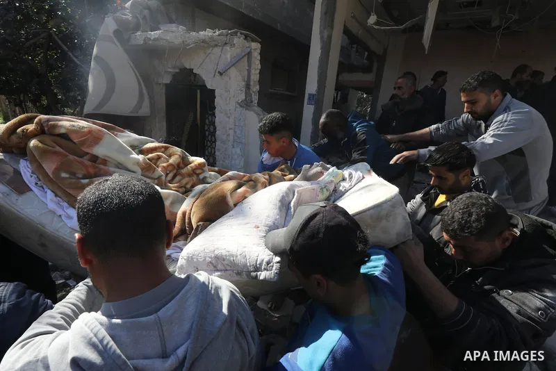 Locals conduct search and rescue operations among the rubble of buildings destroyed by an Israeli attack on Zawaida in Deir al Balah, Gaza on February 22, 2024. Photo by Omar Ashtawy\ apaimages