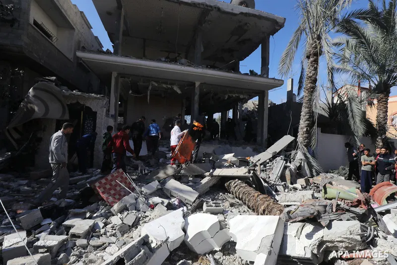 Locals conduct search and rescue operations among the rubble of buildings destroyed by an Israeli attack on Zawaida in Deir al Balah, Gaza on February 22, 2024. Photo by Omar Ashtawy\ apaimages