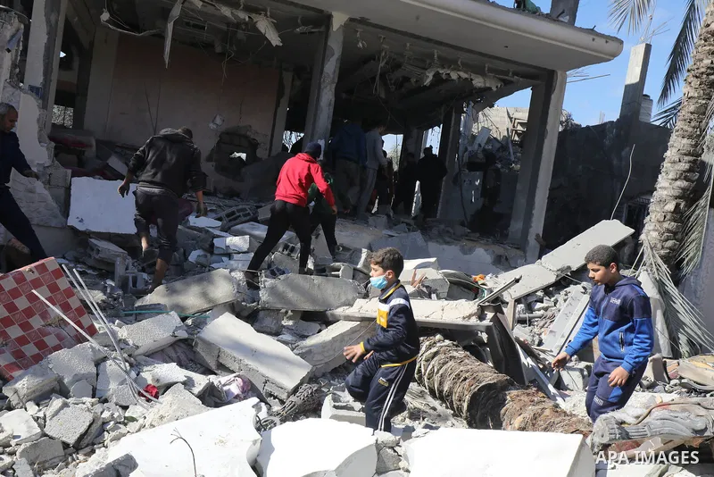 Locals conduct search and rescue operations among the rubble of buildings destroyed by an Israeli attack on Zawaida in Deir al Balah, Gaza on February 22, 2024. Photo by Omar Ashtawy\ apaimages