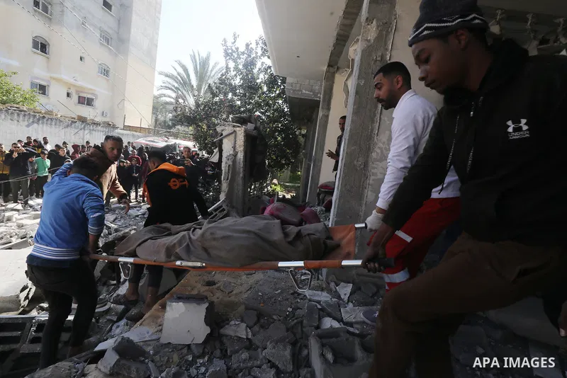 Locals conduct search and rescue operations among the rubble of buildings destroyed by an Israeli attack on Zawaida in Deir al Balah, Gaza on February 22, 2024. Photo by Omar Ashtawy\ apaimages