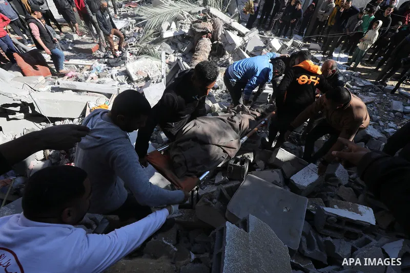 Locals conduct search and rescue operations among the rubble of buildings destroyed by an Israeli attack on Zawaida in Deir al Balah, Gaza on February 22, 2024. Photo by Omar Ashtawy\ apaimages