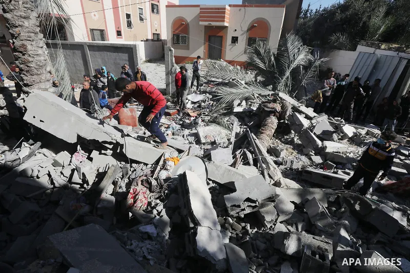Locals conduct search and rescue operations among the rubble of buildings destroyed by an Israeli attack on Zawaida in Deir al Balah, Gaza on February 22, 2024. Photo by Omar Ashtawy\ apaimages