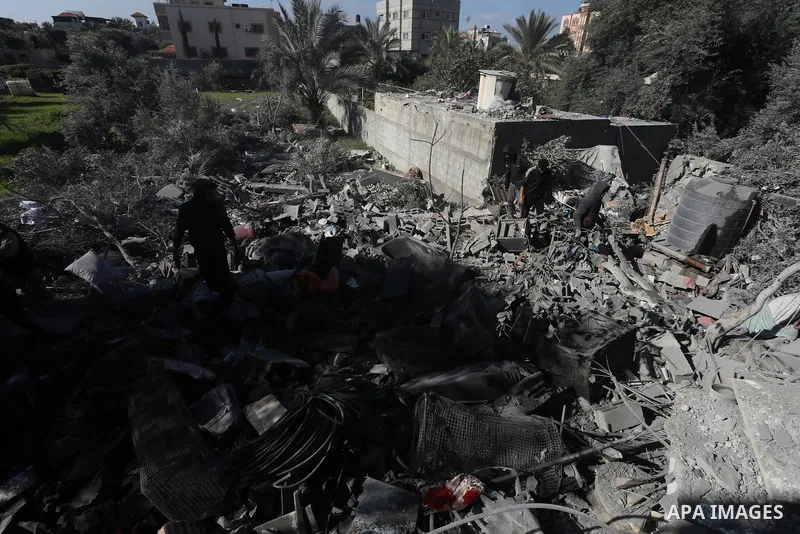 Locals conduct search and rescue operations among the rubble of buildings destroyed by an Israeli attack on Zawaida in Deir al Balah, Gaza on February 22, 2024. Photo by Omar Ashtawy\ apaimages