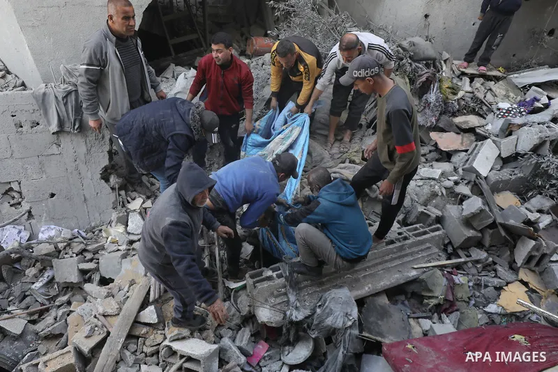 Locals conduct search and rescue operations among the rubble of buildings destroyed by an Israeli attack on Zawaida in Deir al Balah, Gaza on February 22, 2024. Photo by Omar Ashtawy\ apaimages