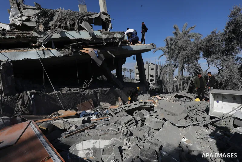 Locals conduct search and rescue operations among the rubble of buildings destroyed by an Israeli attack on Zawaida in Deir al Balah, Gaza on February 22, 2024. Photo by Omar Ashtawy\ apaimages