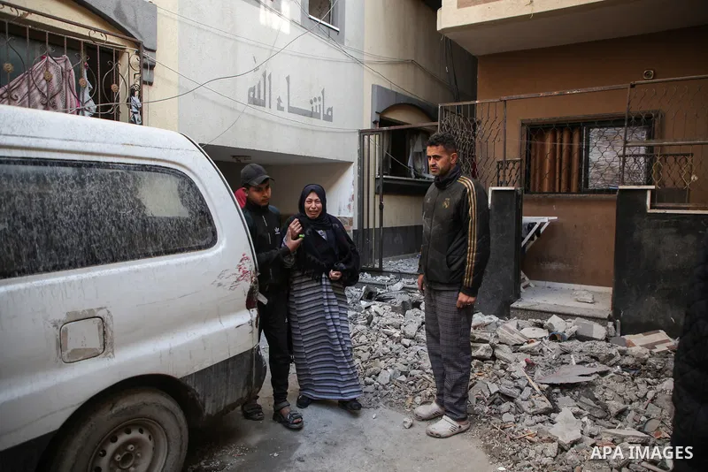 Palestinian artist Mahmoud Zuaiter inspects the ruins of his house after an air strike on the house in Deir al-Balah in the central Gaza Strip on February 24, 2024. Photo by Bashar Taleb\ apaimages