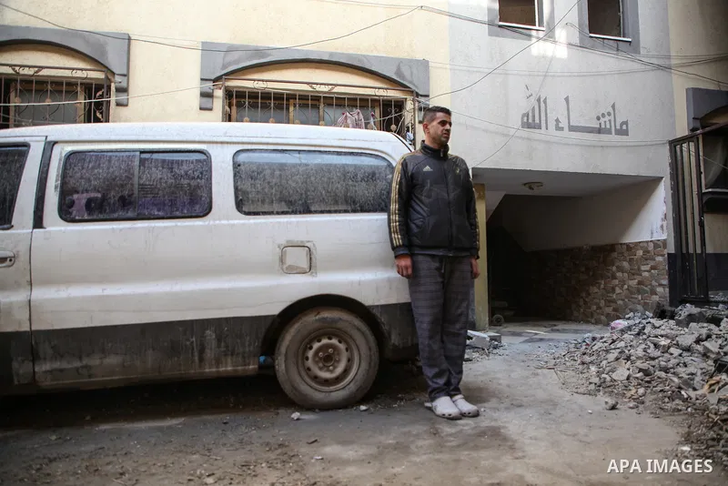 Palestinian artist Mahmoud Zuaiter inspects the ruins of his house after an air strike on the house in Deir al-Balah in the central Gaza Strip on February 24, 2024. Photo by Bashar Taleb\ apaimages
