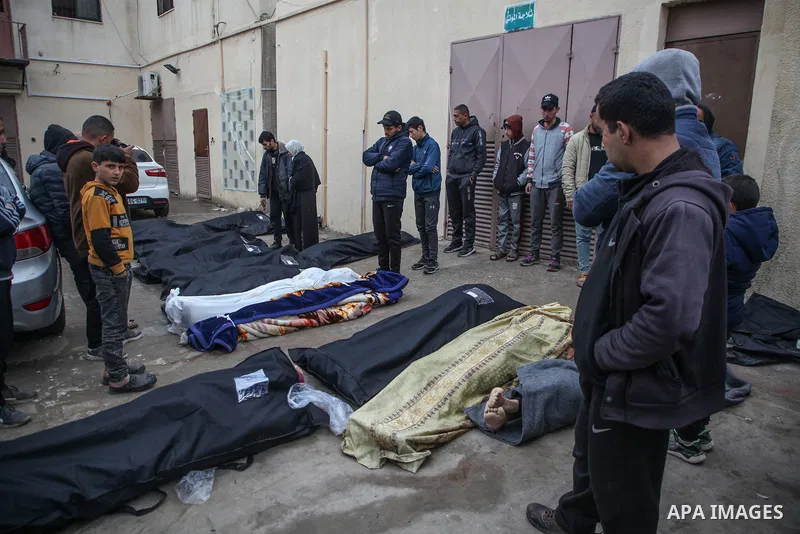 Relatives of the Palestinians died in Israeli attacks, mourn as they receive the dead bodies from the morgue of Al-Aqsa Hospital for burial in Dair El-Balah, Gaza on February 24, 2024. Photo by Bashar Taleb\ apaimages