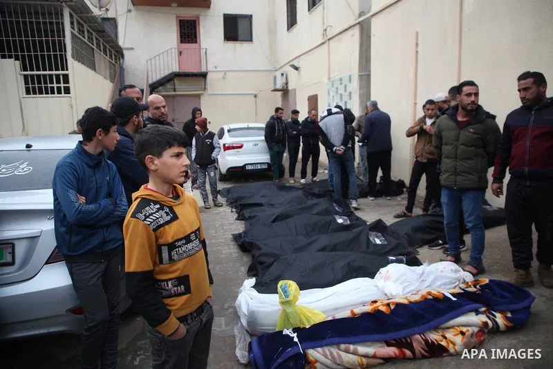 Relatives of the Palestinians died in Israeli attacks, mourn as they receive the dead bodies from the morgue of Al-Aqsa Hospital for burial in Dair El-Balah, Gaza on February 24, 2024. Photo by Bashar Taleb\ apaimages
