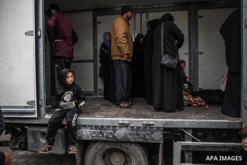 Relatives of the Palestinians died in Israeli attacks, mourn as they receive the dead bodies from the morgue of Al-Aqsa Hospital for burial in Dair El-Balah, Gaza on February 24, 2024. Photo by Bashar Taleb\ apaimages