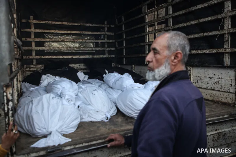 Relatives of the Palestinians died in Israeli attacks, mourn as they receive the dead bodies from the morgue of Al-Aqsa Hospital for burial in Dair El-Balah, Gaza on February 24, 2024. Photo by Bashar Taleb\ apaimages