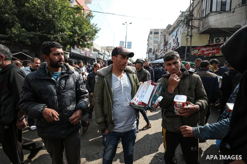 Palestinians, who took refuge in Dair El-Balah City, flock to the bazaars to meet their needs as Israeli attacks continue in Dair El-Balah, Gaza Strip on February 24, 2024. Photo by Bashar Taleb\ apaimages