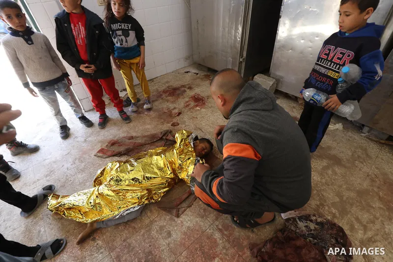 Bodies of Palestinian men, are brought to Al-Aqsa Martyrs Hospital in Dair EL-Balah, following the Israeli attacks in Nusairat, Gaza Strip, on February 29, 2024. Photo by Ali Hamad\ apaimages