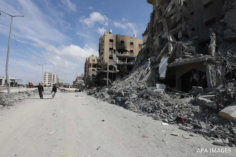 Palestinians inspect damage of the destroyed buildings belonged in the Hamad City, following the Israeli attack on the Khan Yunis, Gaza Strip on March 14, 2024. Photo by Naaman Omar\ apaimages