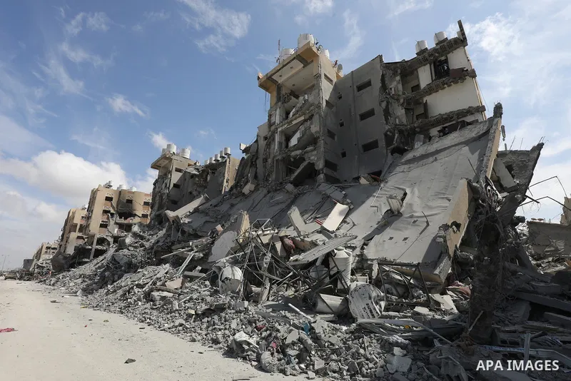 Palestinians inspect damage of the destroyed buildings belonged in the Hamad City, following the Israeli attack on the Khan Yunis, Gaza Strip on March 14, 2024. Photo by Naaman Omar\ apaimages