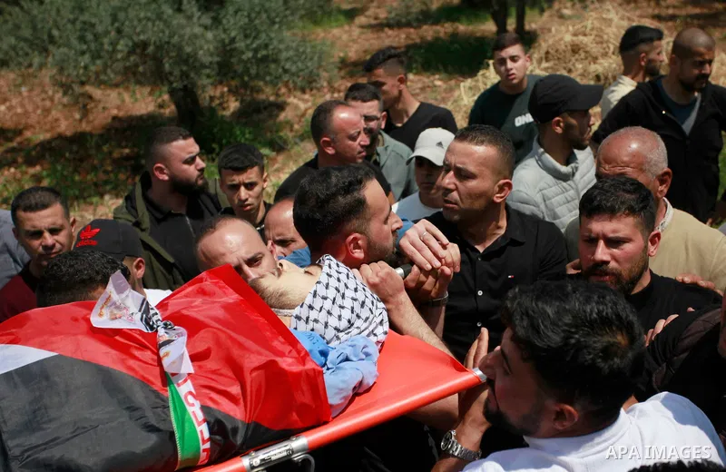 Palestinians mourners carry the body of 16-year-old high school student Yazan Shtayyeh, who was martyred during confrontations with Israeli forces in Nablus, during his funeral in the village of Salem, east of Nablus, on...