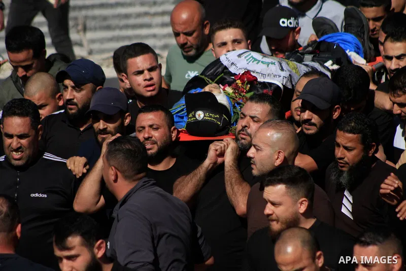 Mourners carry the bodies of Palestinian men killed in an Israeli raid in the Nur Shams camp for Palestinian refugees in the occupied West Bank, during their funeral procession on April 21, 2024. The Israeli army said it...