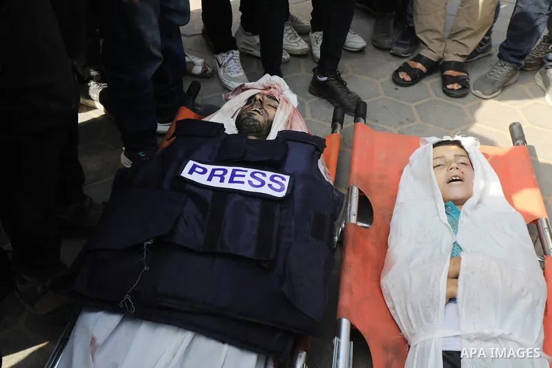 Relatives, loved ones and colleagues of Al-Quds El-Youm TV anchor, journalist Salem Abu Ituor, who was killed in an Israeli army attack on a house, attend his funeral ceremony held in front of Al-Aqsa Martyrs Hospital in...