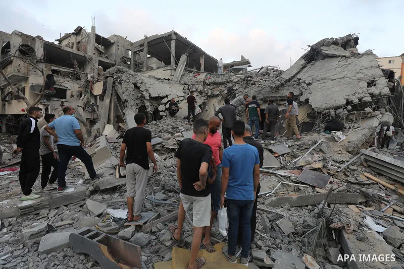 Palestinians look at the destruction after an Israeli airstrike in Deir al Balah, Gaza Strip, Tuesday, April 30, 2024. Photo by Omar Ashtawy\ apaimages
