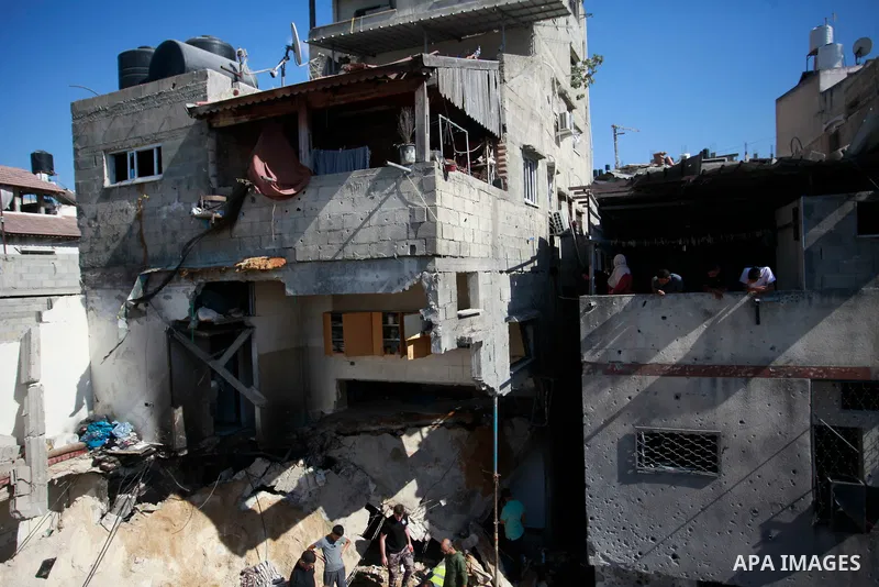 People search the rubble of a building hit by bombardment at the Nur Shams camp for Palestinian refugees, east of Tulkarm in the occupied West Bank, on June 30, 2024. The Palestinian health ministry said an Israeli strik...