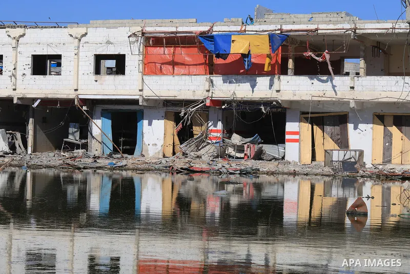 Sewage water is seen in the middle of a street between destroyed buildings in the southern Gaza Strip city of Khan Younis, on July 03, 2024. Health conditions in the Palestinian coastal enclave of Gaza Strip keep worseni...