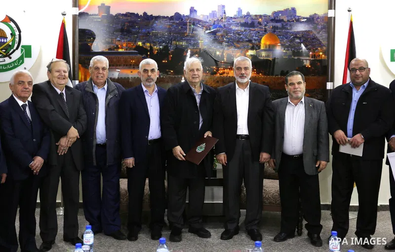 (FILES) Palestinian Hamas chief in the Gaza strip, Ismail Haniyeh, meets with Chairman of the Palestinian Central Election Committee Hana Naser in Gaza city, on November 26, 2019. Iran's Revolutionary Guards said July 31...