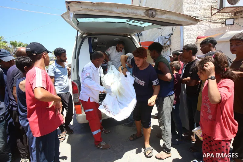 Palestinians carry the bodies of men killed after an Israeli air strike targeted a vehicle in EL-Zawayide area in Gaza City, Gaza on July 31, 2024. Israeli forces targeted a vehicle in EL-Zawayide town in the central Gaz...