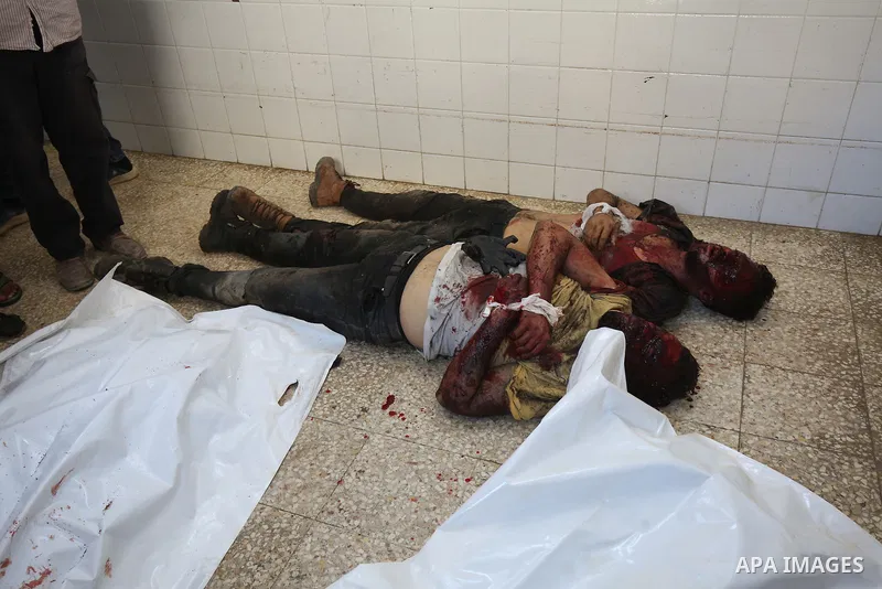 Palestinians carry the bodies of men killed after an Israeli air strike targeted a vehicle in EL-Zawayide area in Gaza City, Gaza on July 31, 2024. Israeli forces targeted a vehicle in EL-Zawayide town in the central Gaz...