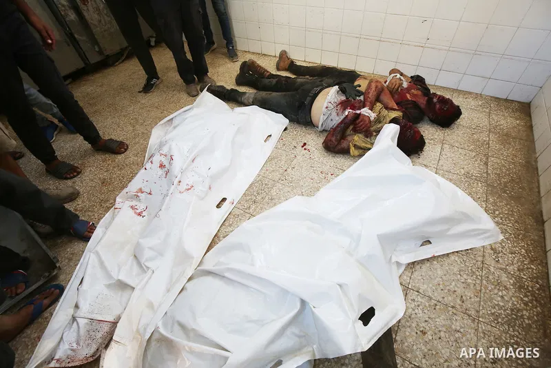 Palestinians carry the bodies of men killed after an Israeli air strike targeted a vehicle in EL-Zawayide area in Gaza City, Gaza on July 31, 2024. Israeli forces targeted a vehicle in EL-Zawayide town in the central Gaz...