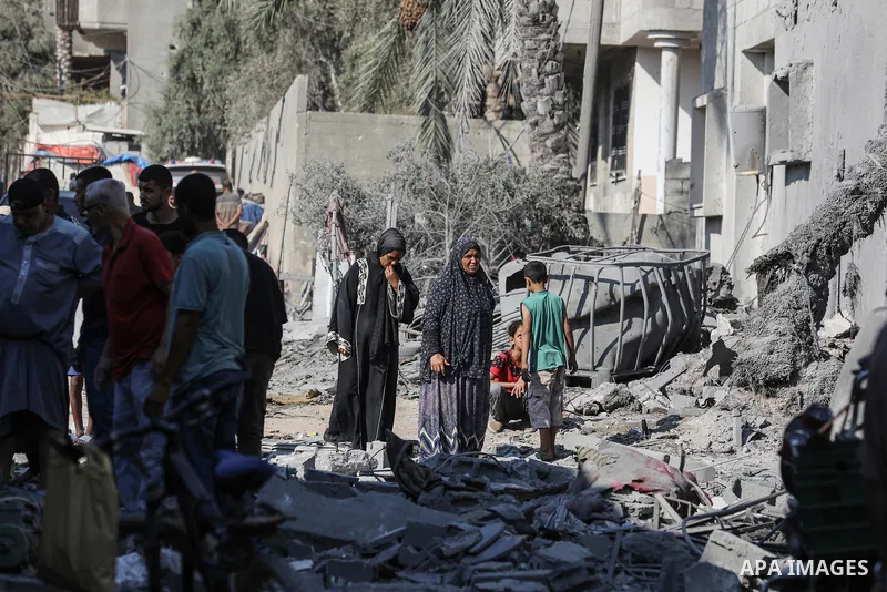 Palestinians check the destruction in Deir el-balah in the central Gaza Strip, on August 7, 2024, following Israeli bombardment amid the ongoing conflict between Israel and the Palestinian Hamas militant group. Photo by...