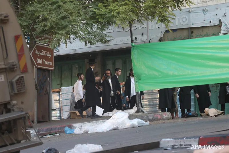 Israeli army forces close commercial markets in the city of Hebron and expel Palestinians from the vicinity of the market in the center of the city, on 13 August 2024. The army is implementing this closure to allow settl...