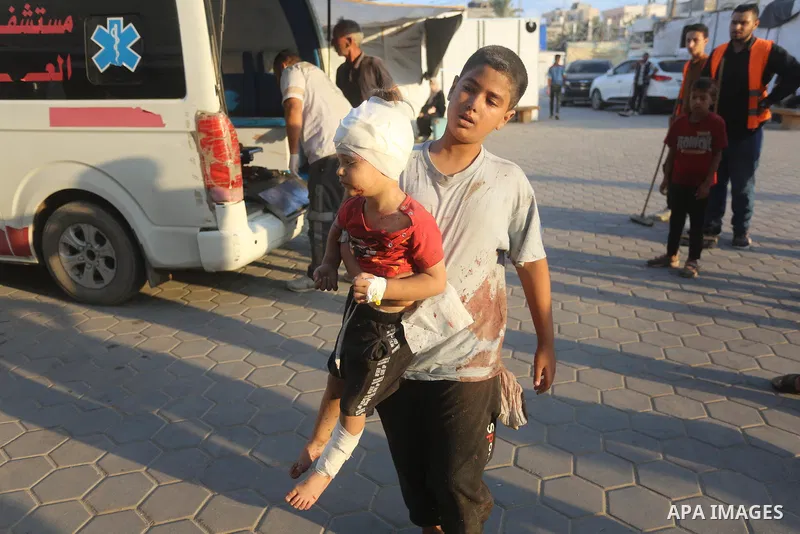 Palestinians, who got injured in Israeli attacks at al-Nusairat refugee camp, are brought to Al Awda Hospital for treatment in , Gaza on August 31, 2024. Casualties and injuries were reported after the attack. Photo by O...