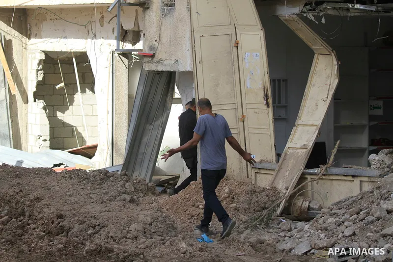 Palestinians walk amid the devastation following an Israeli army raid in Tulkarem in the north of the occupied-West Bank, on September 15, 2024. Photo by Mohammed Nasser\ apaimages