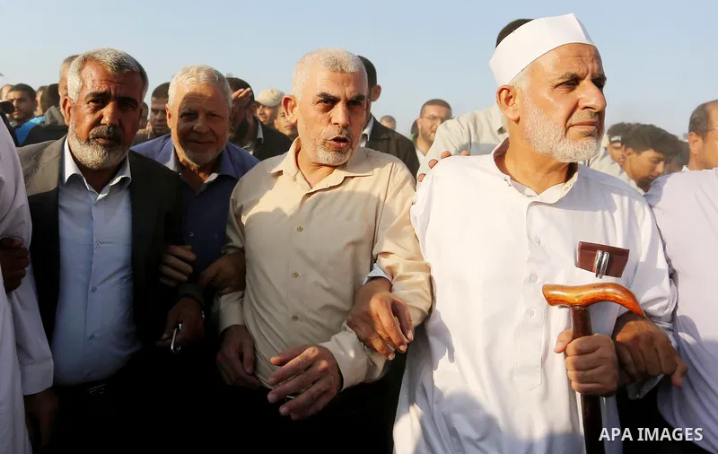 FILE PHOTO: Hamas's leader in the Gaza Strip Yahya Sinwar participates during tents protest where Palestinians demand the right to return to their homeland at the Israel-Gaza border, in Khan Younis in the southern of Gaz...